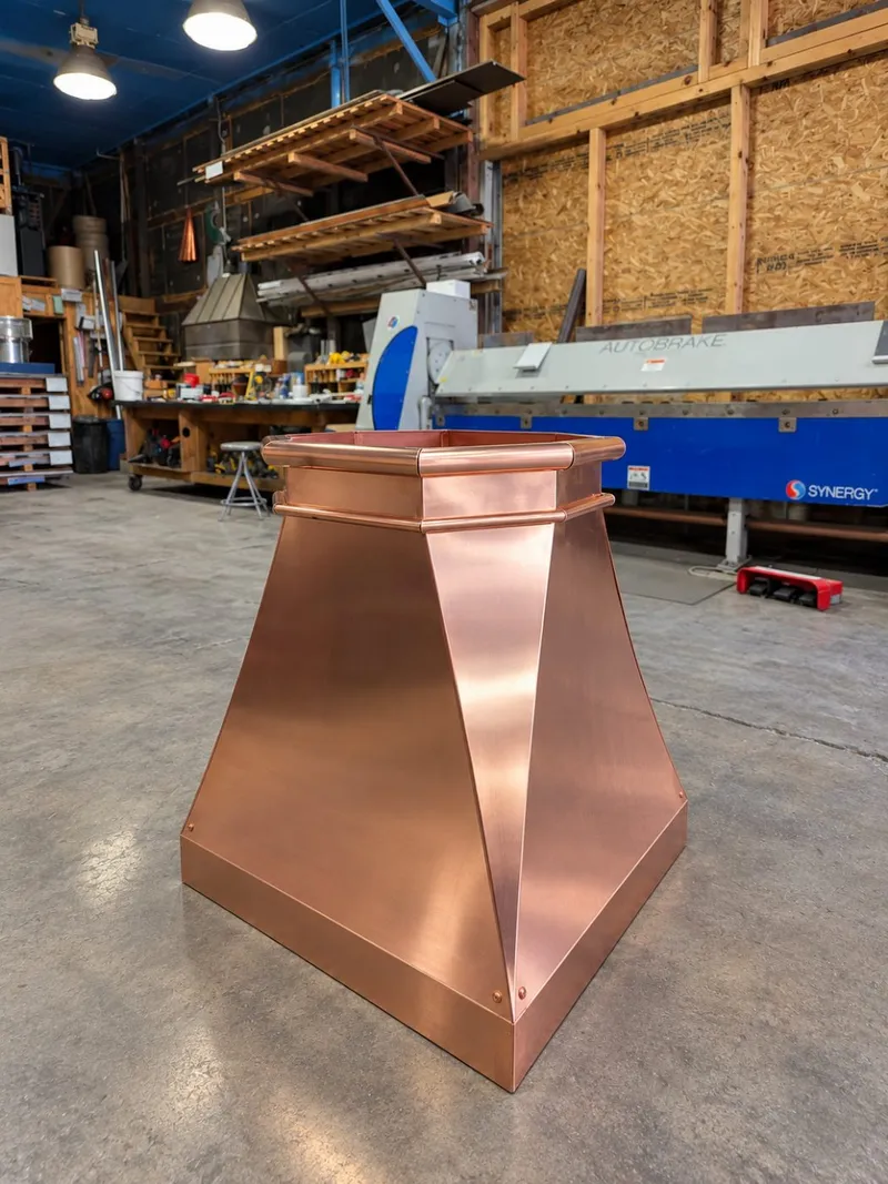 Custom fabricated copper chimney cap in the Mid-Ohio Metals shop